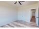 Spacious bedroom with wood floors, a ceiling fan, double closets, and neutral paint at 2906 Lathan Rd, Monroe, NC 28112