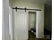 Walk-in closet with barn door entry at 2906 Lathan Rd, Monroe, NC 28112