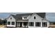 White farmhouse with gray roof and black window accents at 2906 Lathan Rd, Monroe, NC 28112