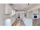 Spacious kitchen boasts white cabinets, granite counters, stainless appliances, and a central island at 2906 Lathan Rd, Monroe, NC 28112