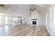 Open living space connects the kitchen and a cozy fireplace feature wall at 2906 Lathan Rd, Monroe, NC 28112