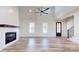 Inviting living room features a vaulted ceiling, fireplace, and large windows for natural light at 2906 Lathan Rd, Monroe, NC 28112