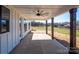 Covered patio with wood columns overlooking landscaped backyard at 2906 Lathan Rd, Monroe, NC 28112