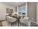 Elegant dining room with a wood table, neutral chairs, and modern art at 3016 Ora Smith Rd, Lincolnton, NC 28092