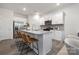 Modern kitchen with white cabinets, granite counters, and island seating at 3016 Ora Smith Rd, Lincolnton, NC 28092