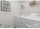 Clean laundry room with washer, dryer, and shelving at 3016 Ora Smith Rd, Lincolnton, NC 28092