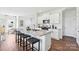 Modern kitchen with white cabinets, granite island, and stainless steel appliances at 3028 Ora Smith Rd, Lincolnton, NC 28092