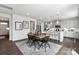 Dining area with modern table, chairs, and open view to the kitchen at 3312 Meadow Wood Ct, Maiden, NC 28650