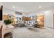 Inviting living room featuring a comfortable sectional sofa and stylish decor on the accent wall at 3312 Meadow Wood Ct, Maiden, NC 28650