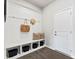 Functional mudroom with built-in bench, storage, and hooks at 3312 Meadow Wood Ct, Maiden, NC 28650