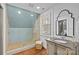 Bathroom featuring a walk-in shower, vanity with sink, and natural light at 373 Hillside Ave, Charlotte, NC 28209