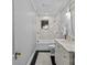 Modern bathroom featuring marble tile, dual shower heads, and a vanity at 373 Hillside Ave, Charlotte, NC 28209