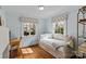 Bright bedroom featuring natural light, hardwood floors, and a desk at 373 Hillside Ave, Charlotte, NC 28209