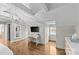 Spacious bedroom featuring a desk area, modern lighting, and hardwood floors at 373 Hillside Ave, Charlotte, NC 28209