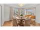 Bright dining room with hardwood floors, stylish lighting, and a large window at 373 Hillside Ave, Charlotte, NC 28209