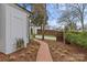 Beautifully landscaped pathway leading to the home, showcasing mature trees and plantings at 373 Hillside Ave, Charlotte, NC 28209