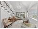 Bright foyer with staircase and view through sliding glass doors to the backyard at 373 Hillside Ave, Charlotte, NC 28209