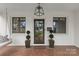 Close-up of the home's front porch, featuring a decorative door and hanging light fixture at 373 Hillside Ave, Charlotte, NC 28209