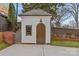 Detached garage featuring carriage doors and classic architectural details at 373 Hillside Ave, Charlotte, NC 28209