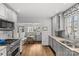 Well-lit kitchen with stainless steel appliances and breakfast nook at 373 Hillside Ave, Charlotte, NC 28209