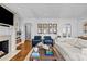 Bright living room with hardwood floors, fireplace, and arched doorways at 373 Hillside Ave, Charlotte, NC 28209