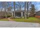 Inviting screened porch with hammock, seamlessly blending indoor and outdoor living at 373 Hillside Ave, Charlotte, NC 28209