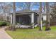 Charming screened porch with a hammock, creating a peaceful outdoor retreat at 373 Hillside Ave, Charlotte, NC 28209