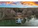 Aerial view of house, dock, and lake at sunset at 3917 Acacia N Rd, York, SC 29745