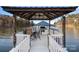 Covered dock with seating area and lake views at 3917 Acacia N Rd, York, SC 29745