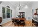 Bright dining room with hardwood floors, large window, and antique china cabinet at 3917 Acacia N Rd, York, SC 29745