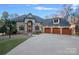 Brick home with three car garage and driveway at 3917 Acacia N Rd, York, SC 29745