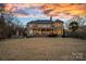 Brick house exterior with large deck at sunset at 3917 Acacia N Rd, York, SC 29745