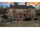 Brick house exterior with large deck and balconies at sunset at 3917 Acacia N Rd, York, SC 29745