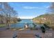 Stunning lake view from a deck with wooden table at 3917 Acacia N Rd, York, SC 29745