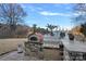 Outdoor kitchen with pizza oven and grill, perfect for lakefront entertaining at 3917 Acacia N Rd, York, SC 29745