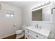 Modern bathroom featuring a white vanity with granite countertop, updated fixtures, and a well-lit mirror at 3988 Crestview Dr, Rock Hill, SC 29732