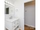 Stylish bathroom with a white vanity, granite countertop, updated lighting, and ample storage space at 3988 Crestview Dr, Rock Hill, SC 29732