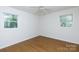 Bright bedroom features two windows and neutral walls and flooring at 3988 Crestview Dr, Rock Hill, SC 29732