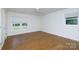 Bedroom features neutral walls and flooring, two windows, and a ceiling fan at 3988 Crestview Dr, Rock Hill, SC 29732