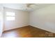 Neutral bedroom with wood floors, a ceiling fan, and a window providing natural light at 3988 Crestview Dr, Rock Hill, SC 29732