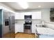 Stylish kitchen with stainless steel appliances, granite countertops, and white cabinets at 3988 Crestview Dr, Rock Hill, SC 29732