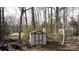 Backyard shed nestled amongst the trees at 3988 Crestview Dr, Rock Hill, SC 29732