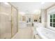 Spa-like bathroom featuring a shower, bathtub, and updated fixtures at 4120 St Timms Ct, Charlotte, NC 28226