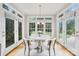 Charming breakfast nook with bright windows and seating for four at 4120 St Timms Ct, Charlotte, NC 28226