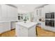 Spacious kitchen with white cabinets, stainless steel appliances, and an island at 4120 St Timms Ct, Charlotte, NC 28226