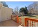 Backyard deck overlooks the grassy lawn, trees, and fence at 413 Shinnville Rd, Mooresville, NC 28115