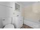 Cozy bathroom featuring a vanity, toilet, and bathtub with shower, offering a functional space at 413 Shinnville Rd, Mooresville, NC 28115