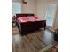 Spacious bedroom with a large bed and hardwood floors at 414 S Yadkin Ave, Spencer, NC 28159