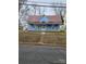 Charming blue house with a red roof and a porch at 414 S Yadkin Ave, Spencer, NC 28159