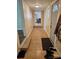 View down a hallway leading to a kitchen and dining area at 414 S Yadkin Ave, Spencer, NC 28159